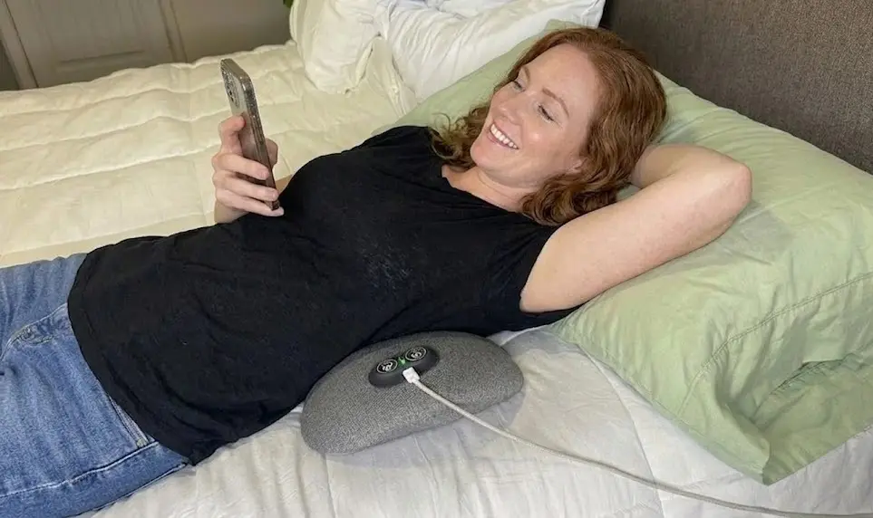 Adult using an at-home spinal comfort support device